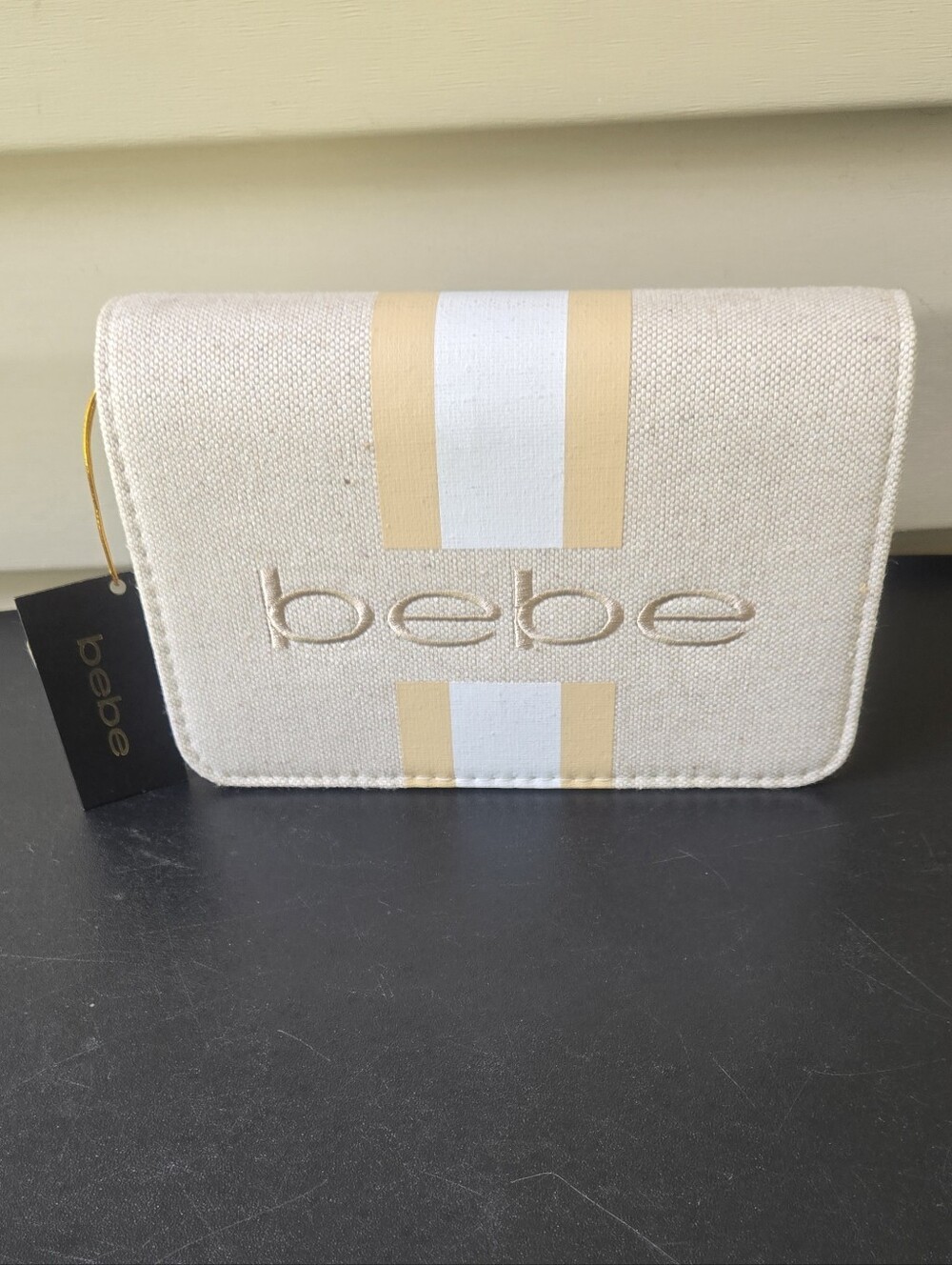 bebe Almond Canvas Crossbody Bag with Gold-Trim Stripe